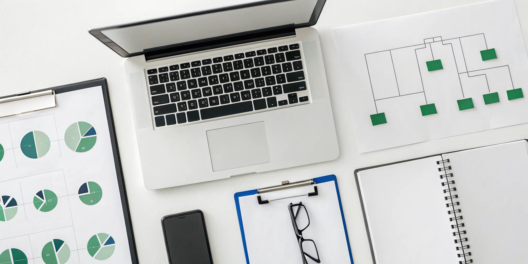 A desk with documents and a laptop prepared for a SOX audit to meet compliance requirements.