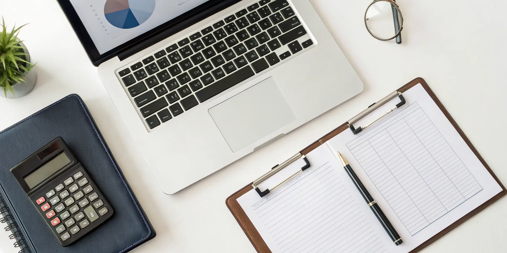 Implementing internal controls for a small business with a laptop, calculator, and clipboard.