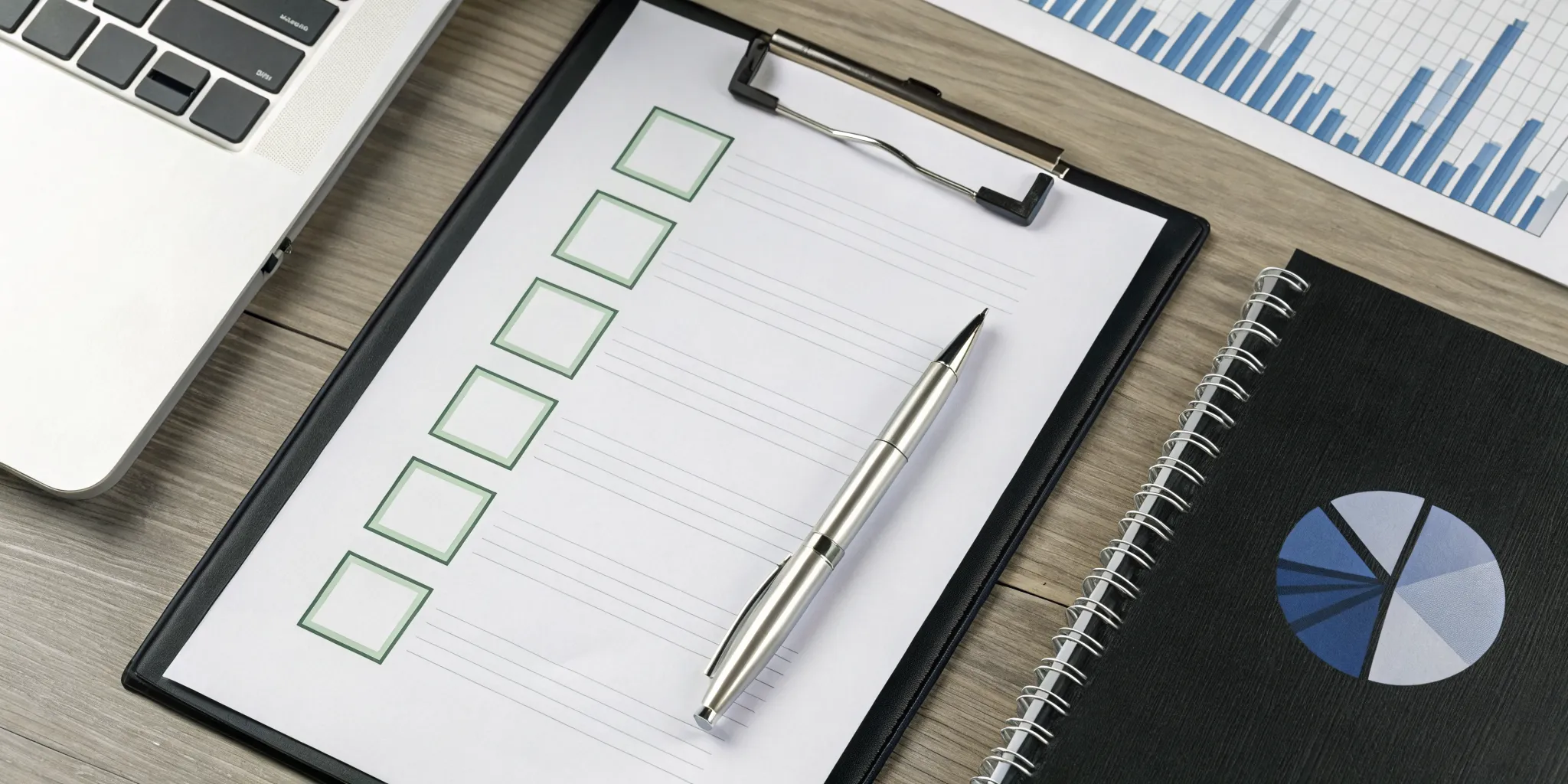 Internal control over financial reporting checklist with a pen and financial chart.